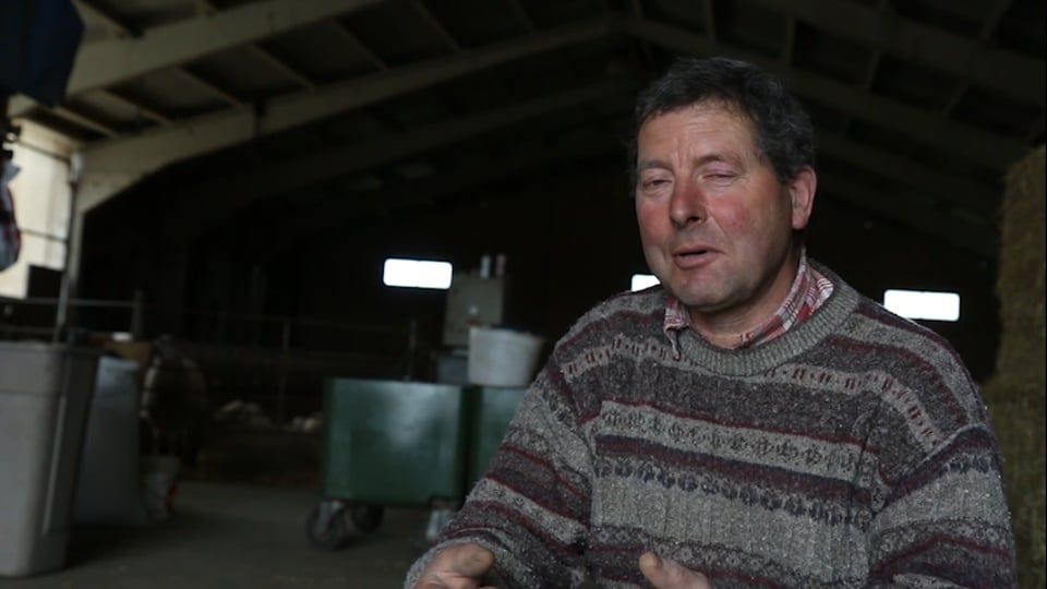 Still from the Zonzo trailer: a man speaks in a farm shed